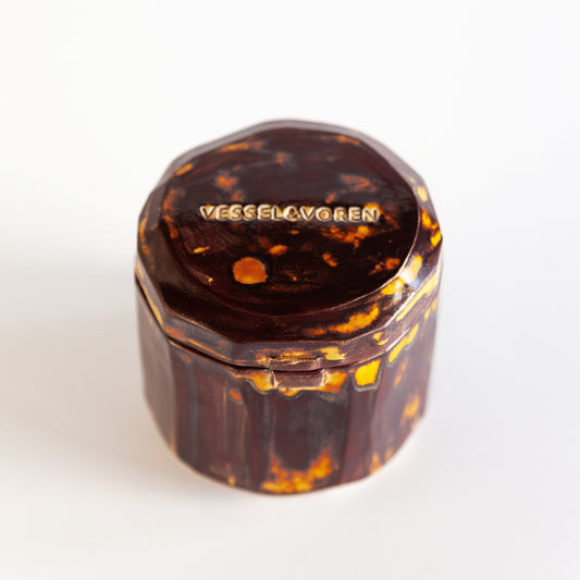 Vanilla Smoke 260 g candle in a handmade amber ceramic vessel