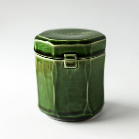 Grapefruit Cream 140 g candle in a handmade green ceramic vessel