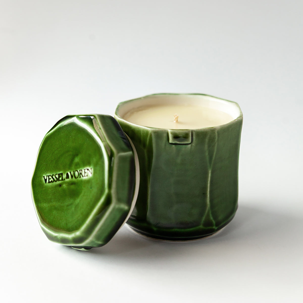 Grapefruit Cream 140 g candle in a handmade green ceramic vessel
