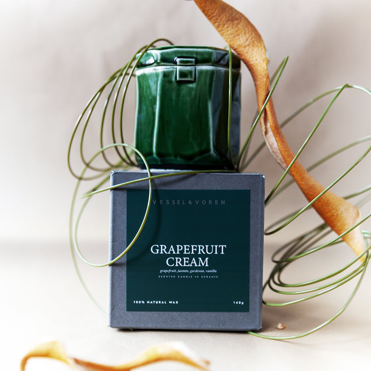 Grapefruit Cream 140 g candle in a handmade green ceramic vessel