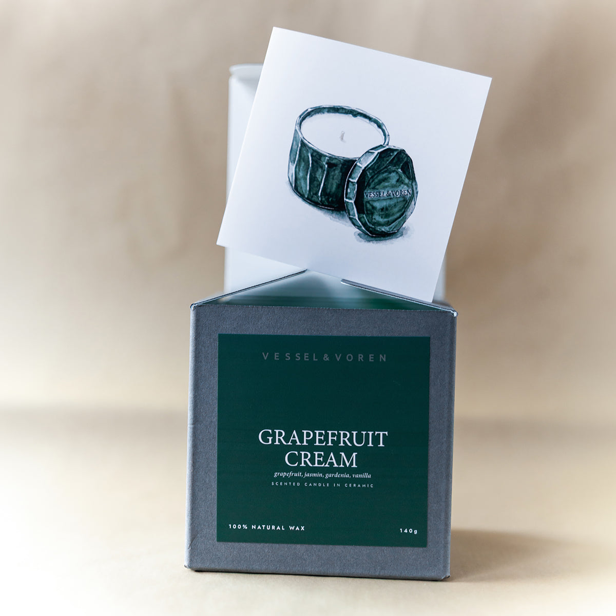 Grapefruit Cream 140 g candle in a handmade green ceramic vessel