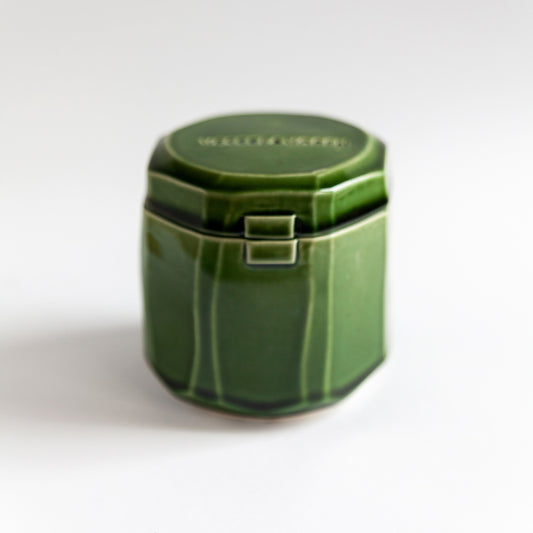 Grapefruit Cream 260 g candle in a handmade green ceramic vessel