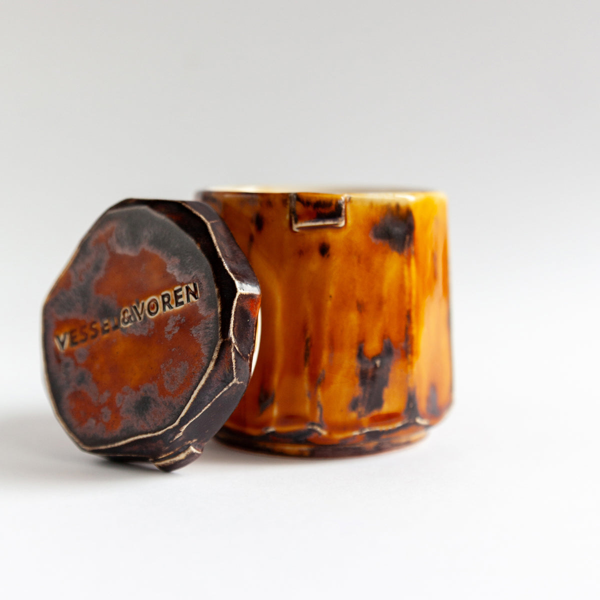 Vanilla Smoke 140 g candle in a handmade amber ceramic vessel