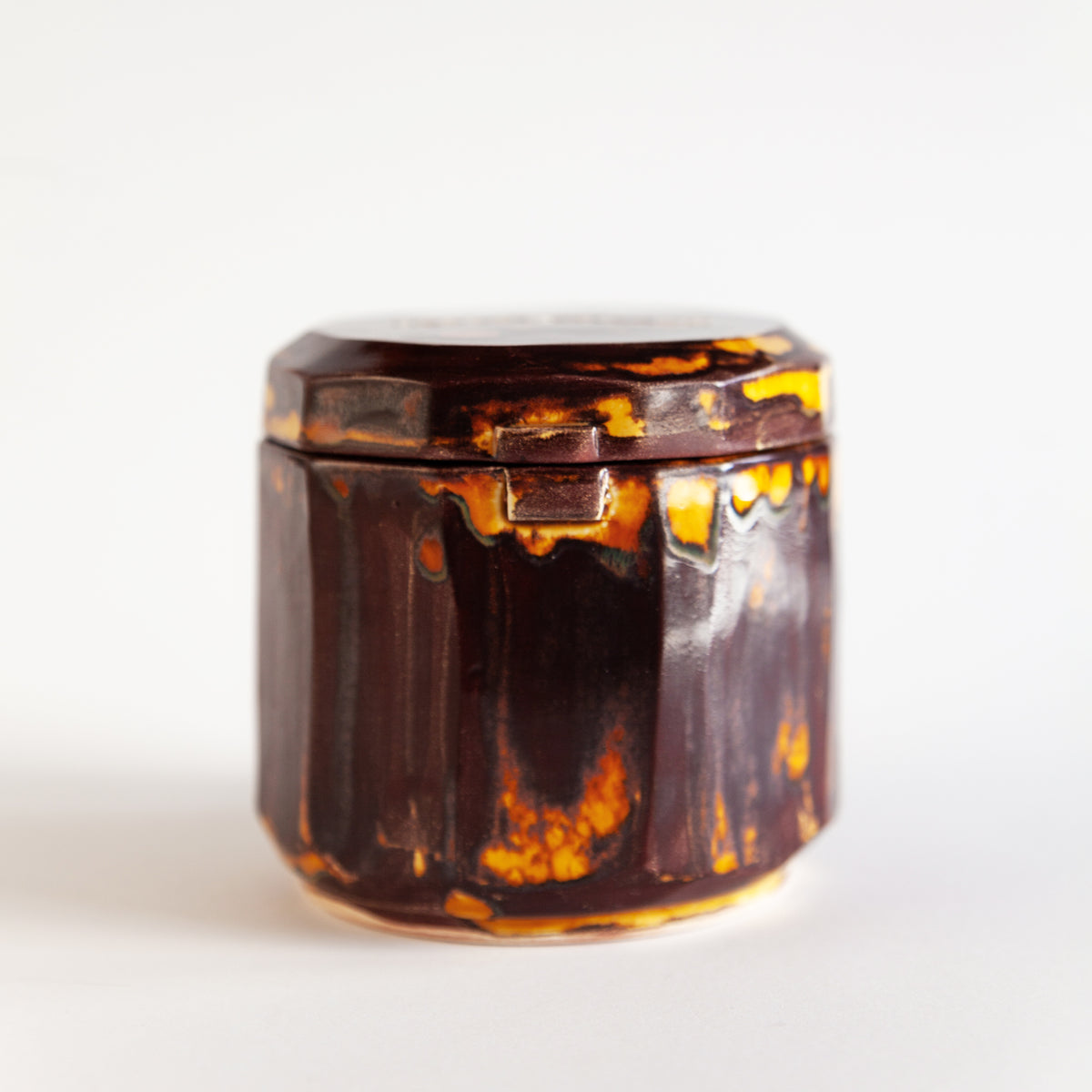 Vanilla Smoke 260 g candle in a handmade amber ceramic vessel